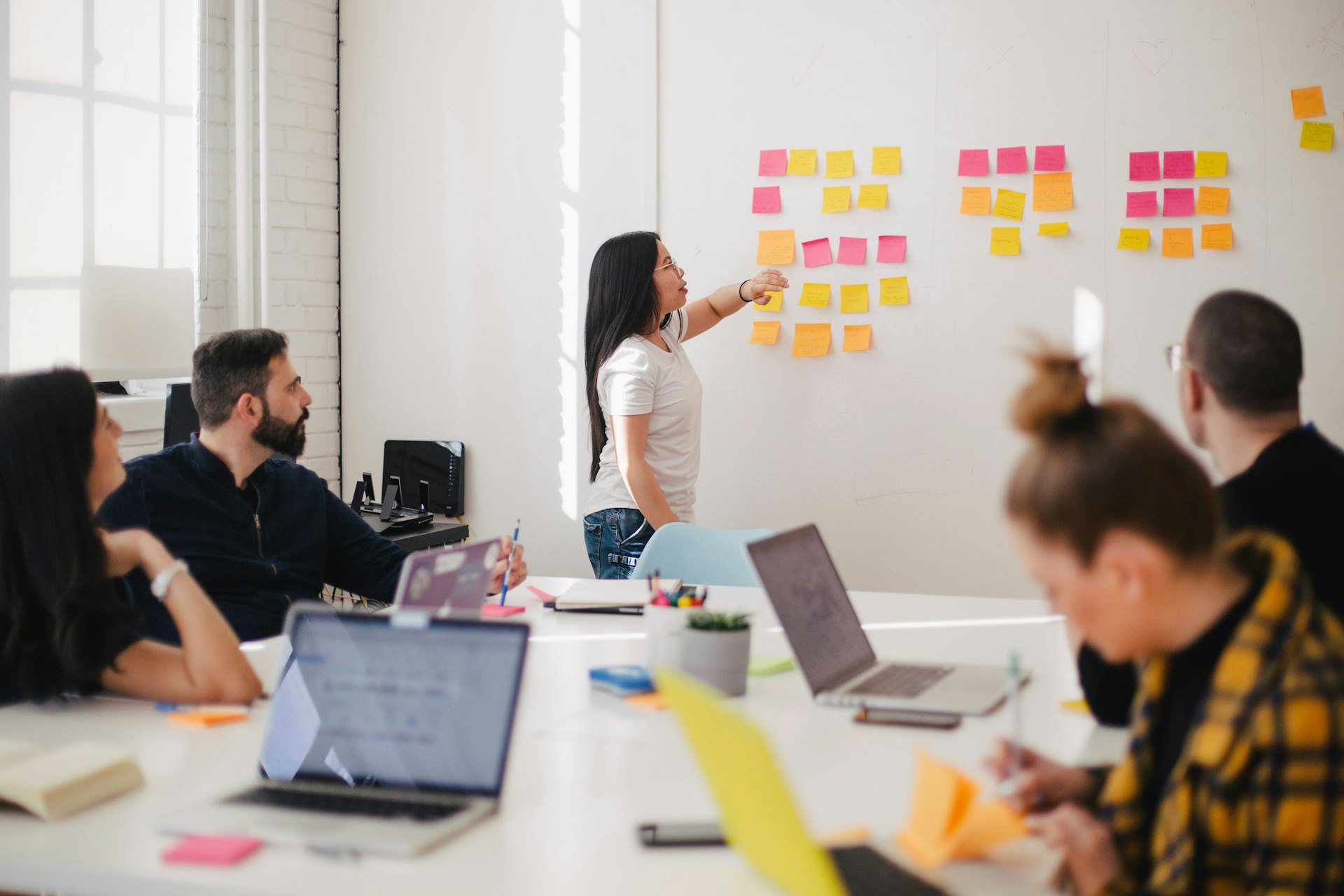 Business professionals collaborating in a strategy workshop session